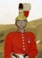 A person wearing a red uniformDescription automatically generated